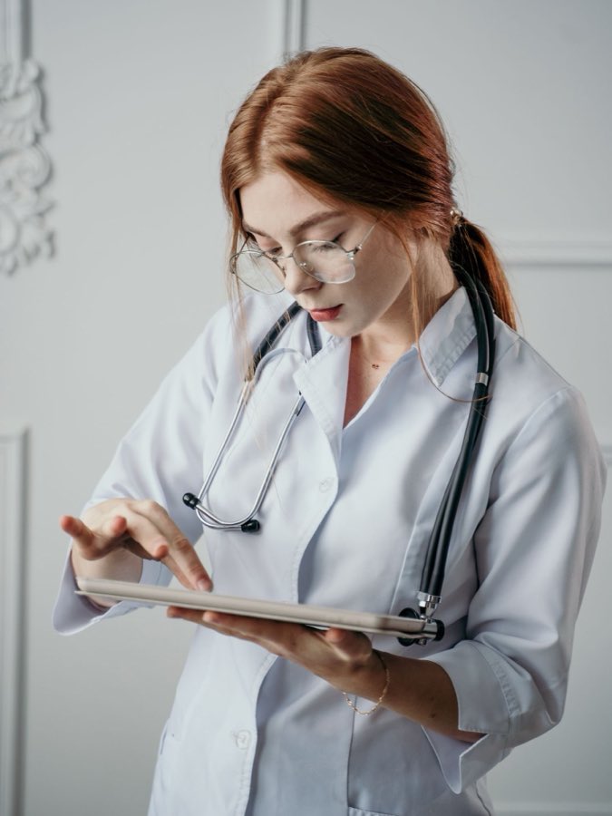 A doctor using a tablet